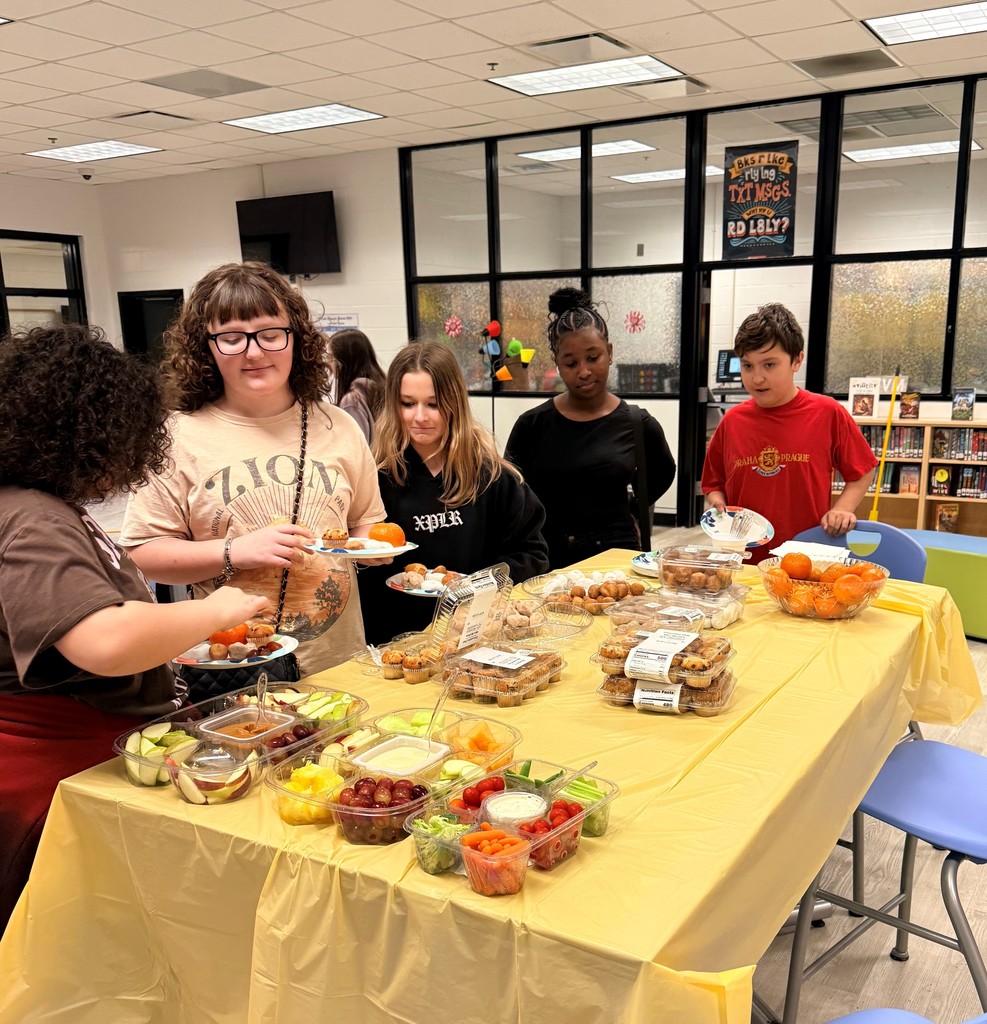 Students enjoy discussing books  over breakfast.