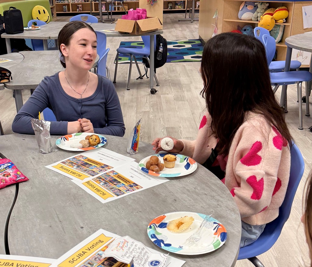 Students enjoy discussing books  over breakfast.