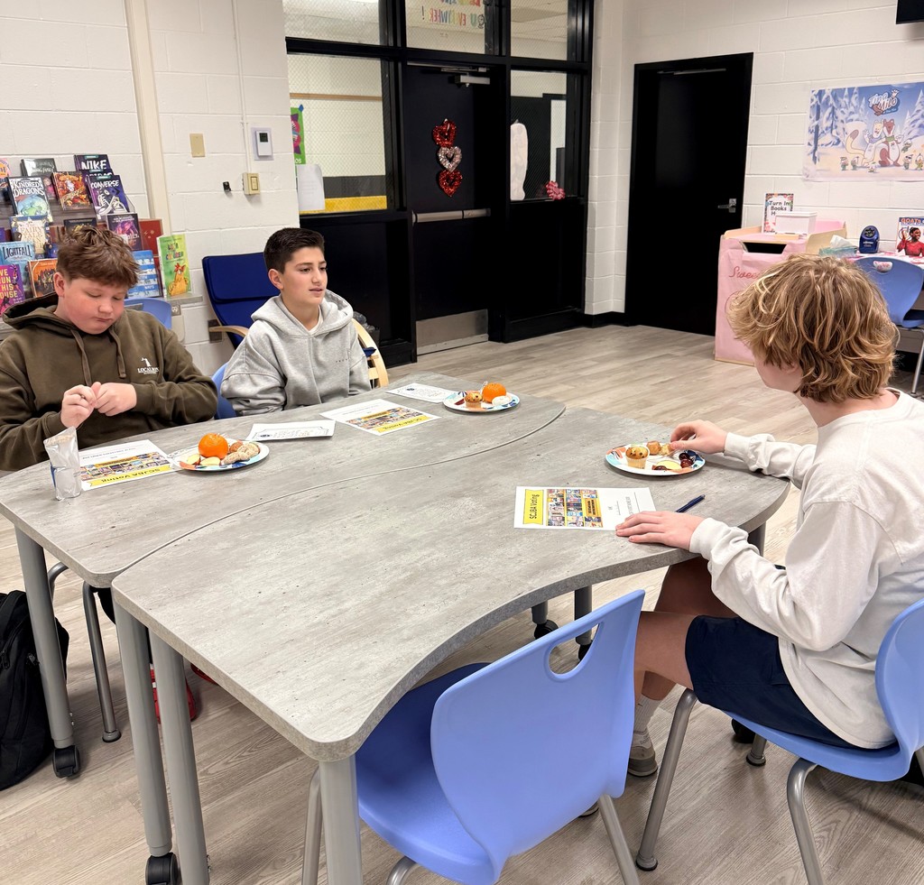 Students enjoy discussing books  over breakfast.
