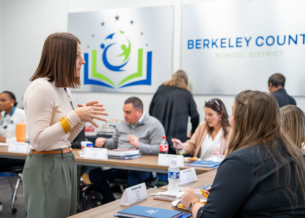 assistant principals talking with Missy LaBerge