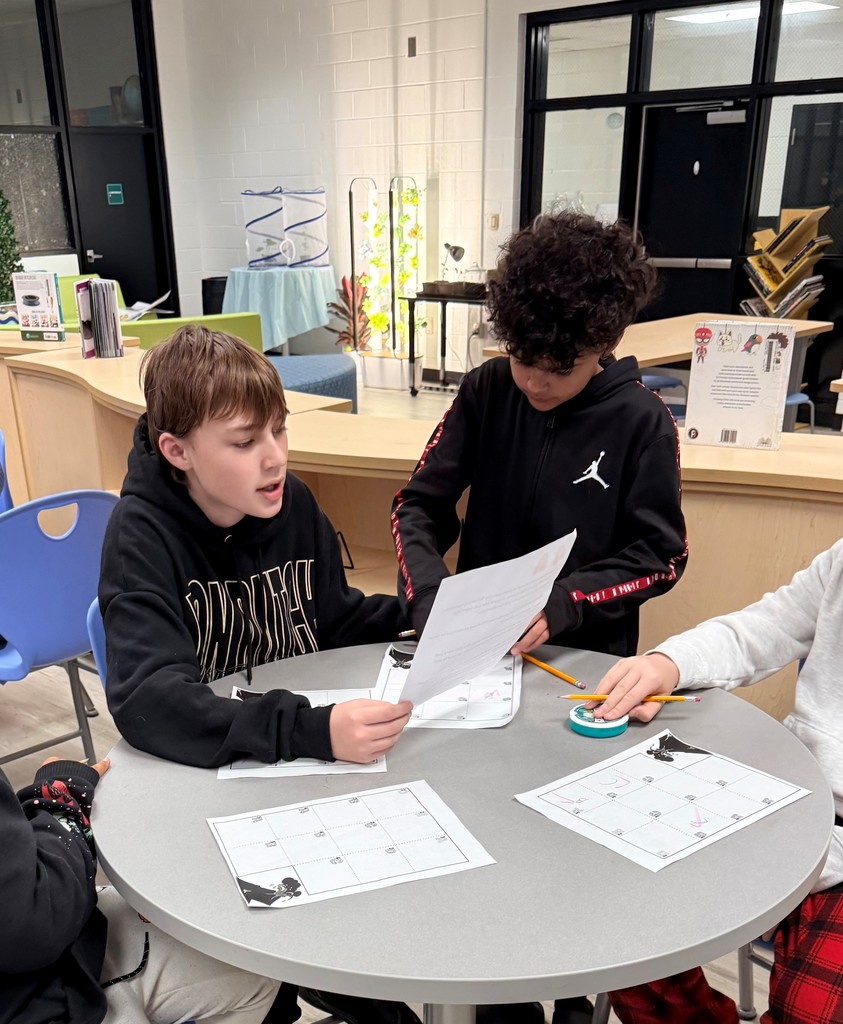 Students enjoy a fun interactive game in the school library.