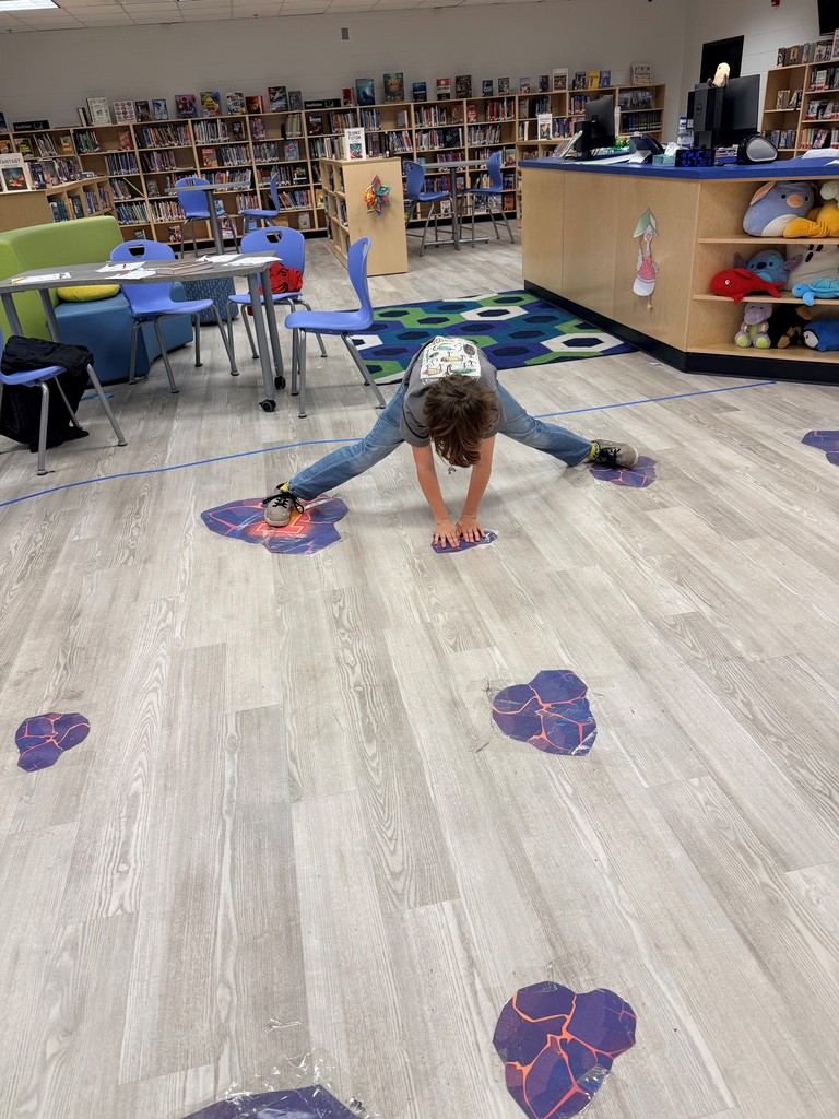 Students enjoy a fun interactive game in the school library.
