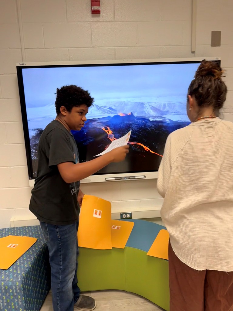 Students enjoy a fun interactive game in the school library.