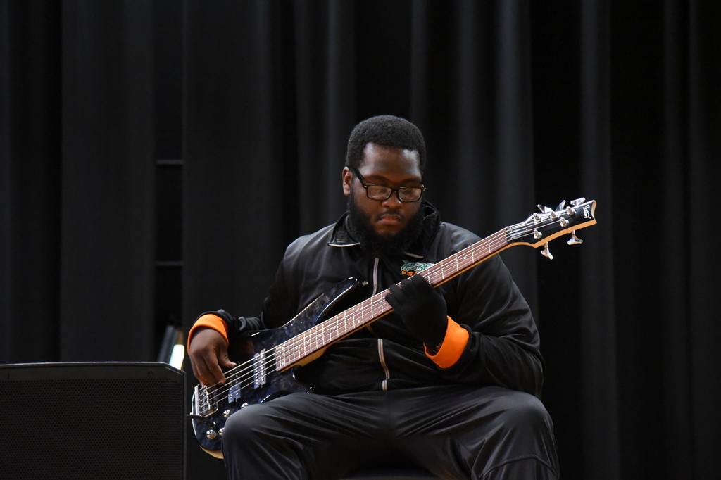 student playing the bass