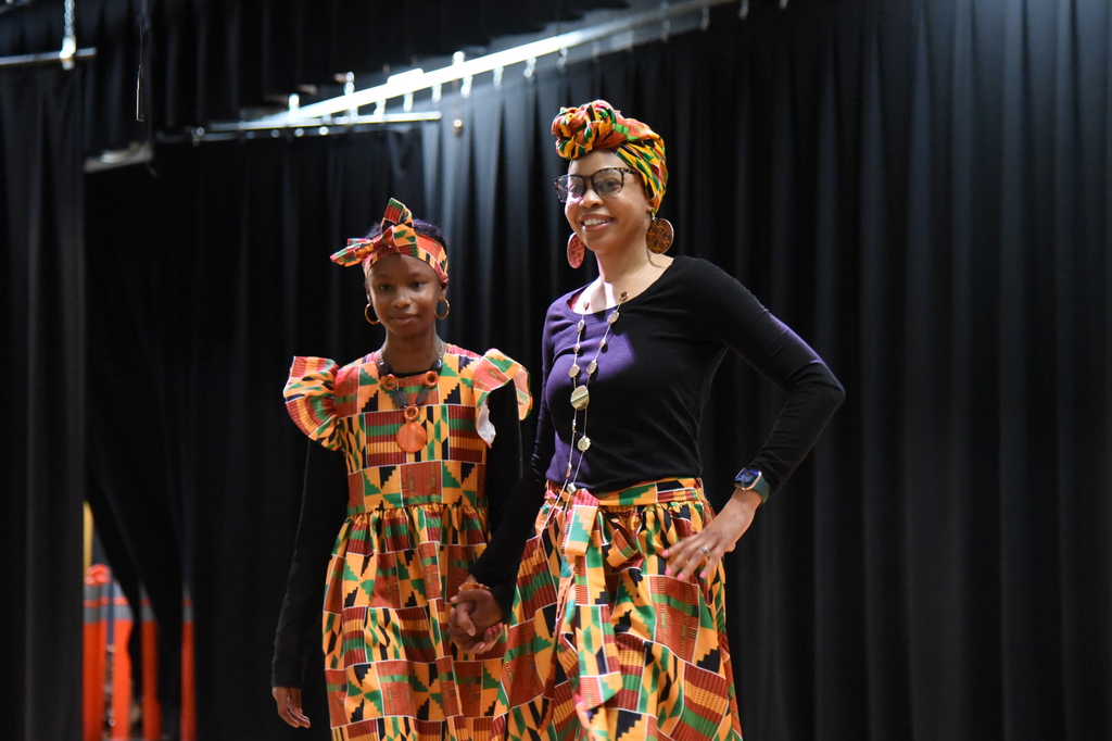 student and teacher in fashion show