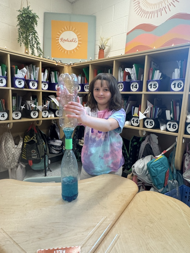 girl in tie dye with tornado bottle  