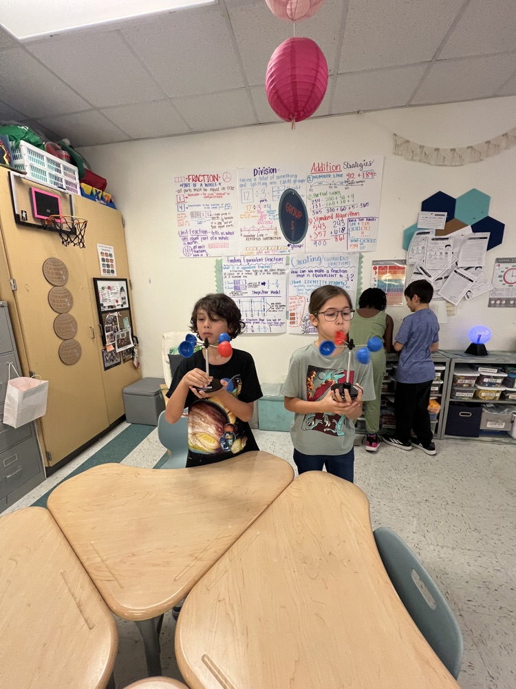 kids exploring an anemometer 