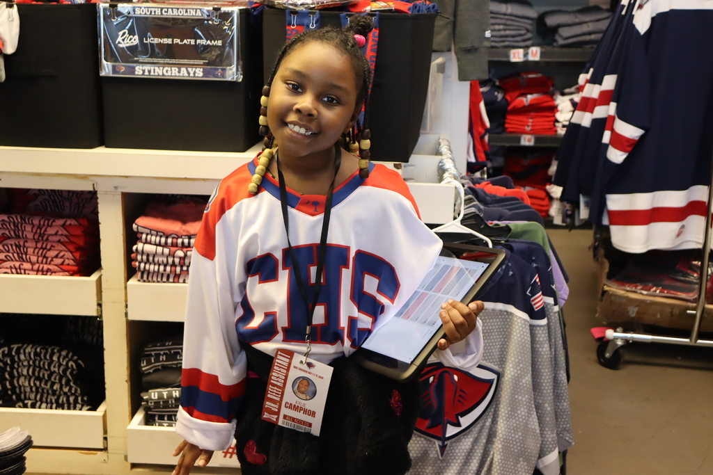 student working in merchandise store