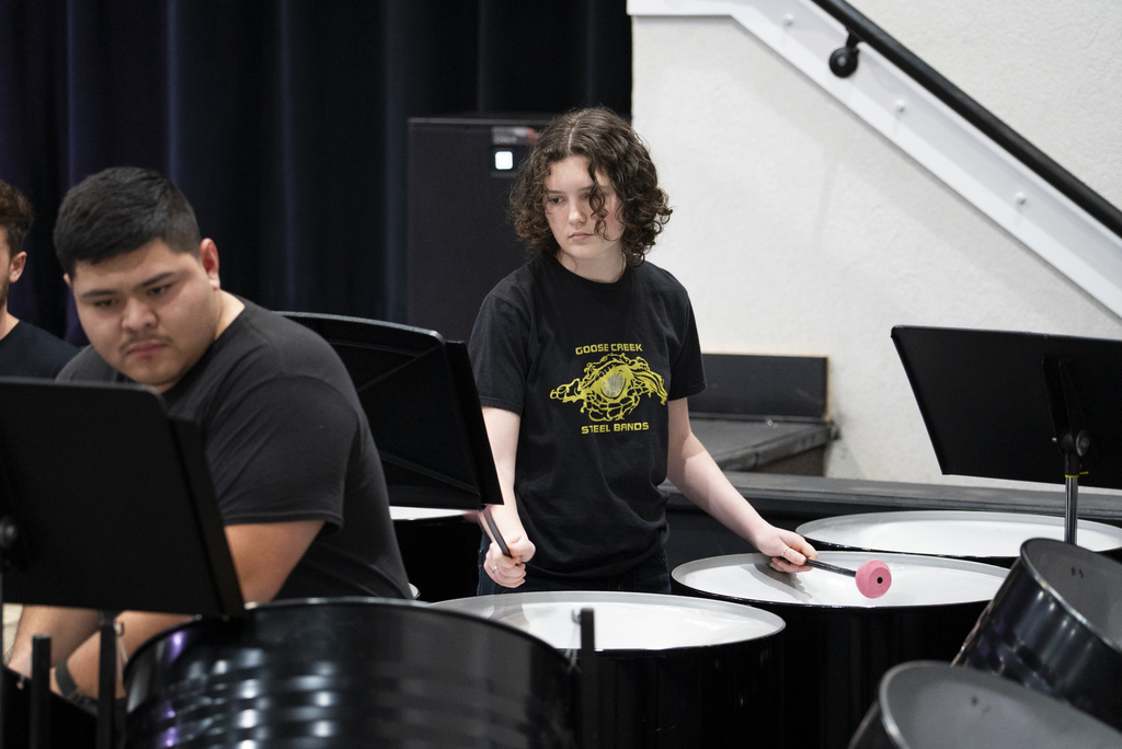 student performing on steel drums