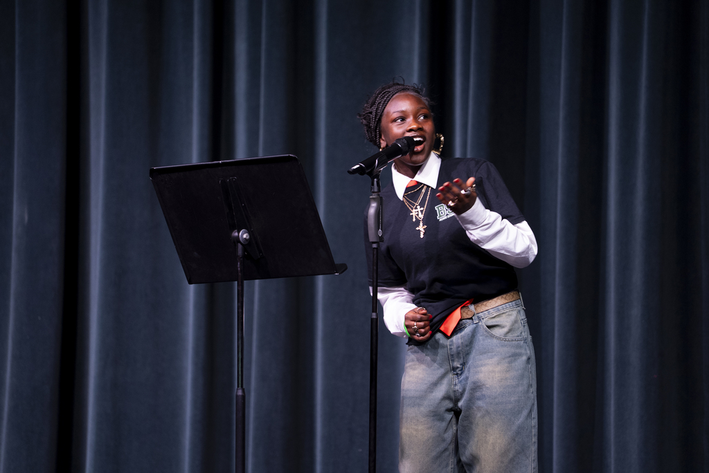 student performing spoken work poetry