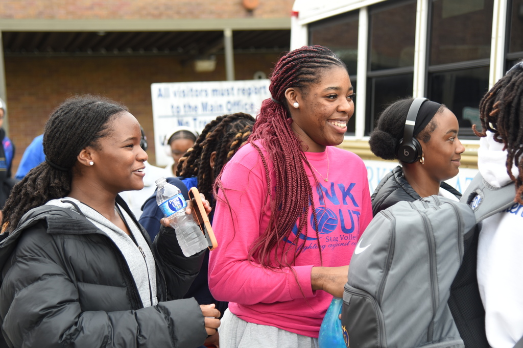 students getting on bus