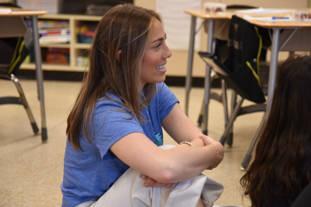 teacher listening to Dr. Dixon read