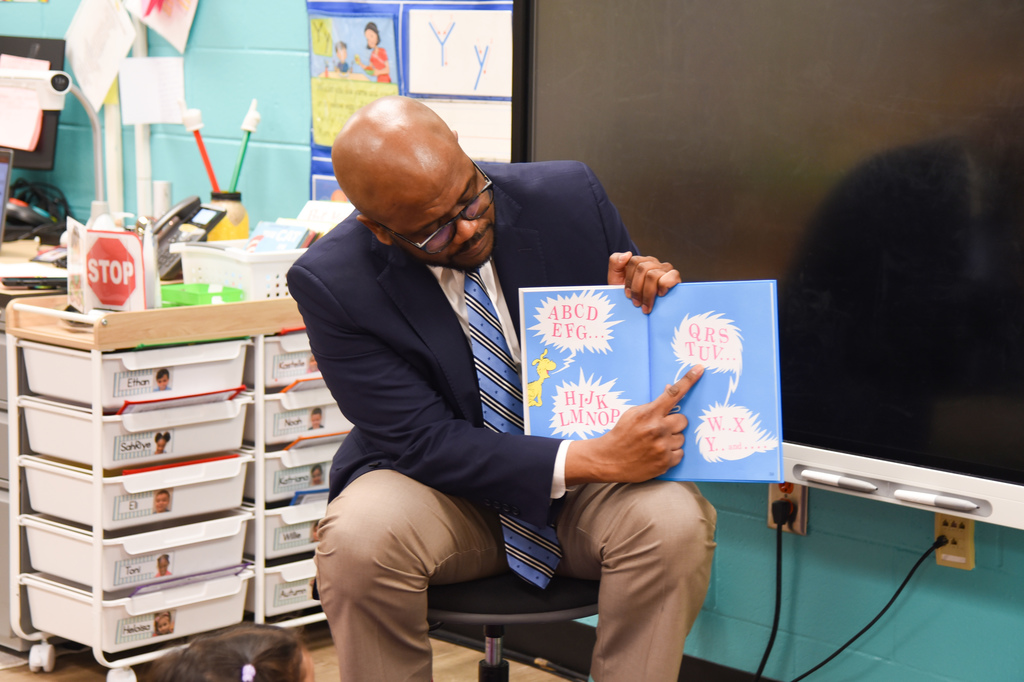 Dr. Dixon pointing to letter