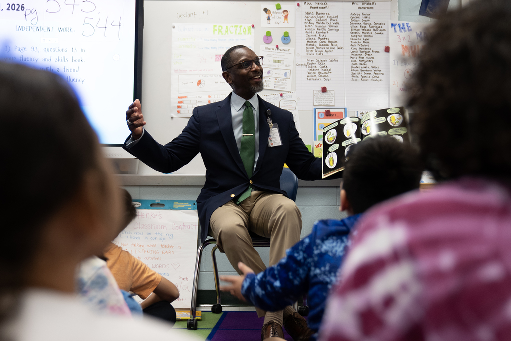 Dr. Middleton reading to class