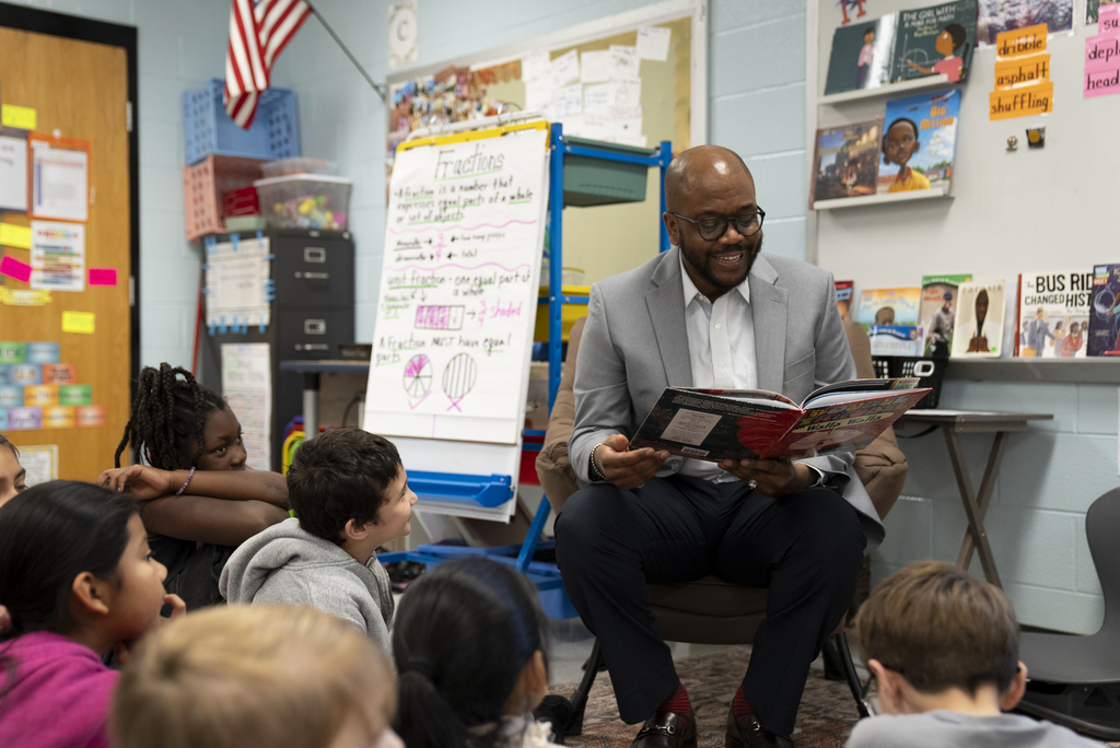 Dr. Dixon reading to class