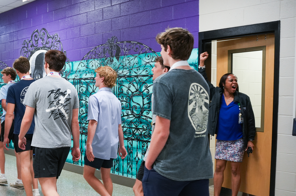 Principal Butler cheers on team