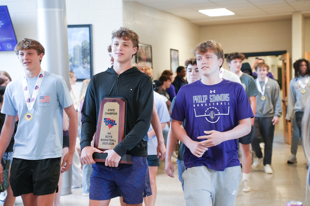 PSH boys basketball team with trophy