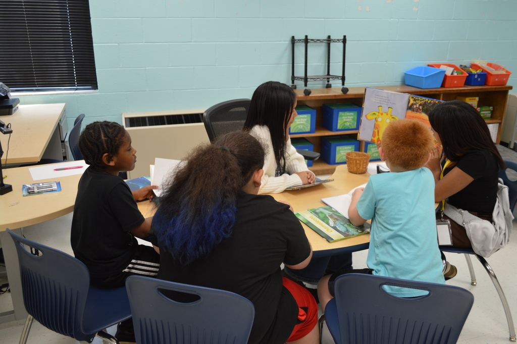 Students listen to a story.