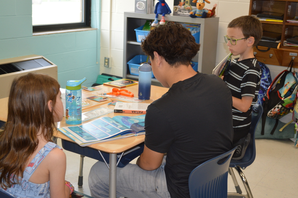 Students listen to a story.