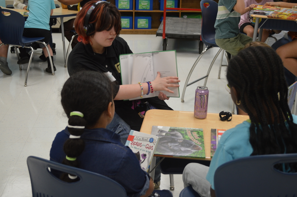 Students listen to a story.