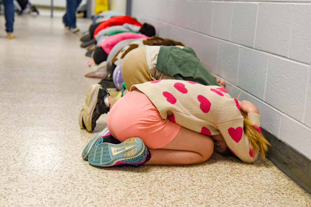 students practicing tornado drill