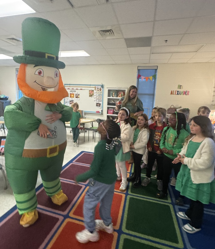student talking with leprechaun