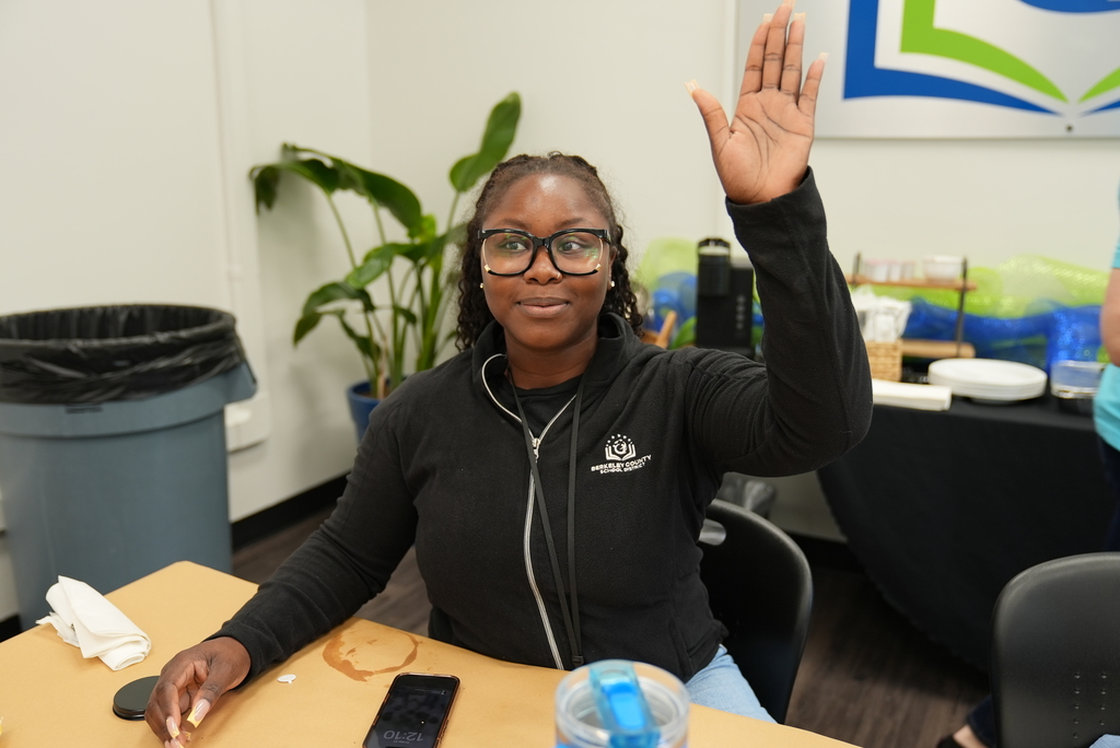 school social worker raising her hand