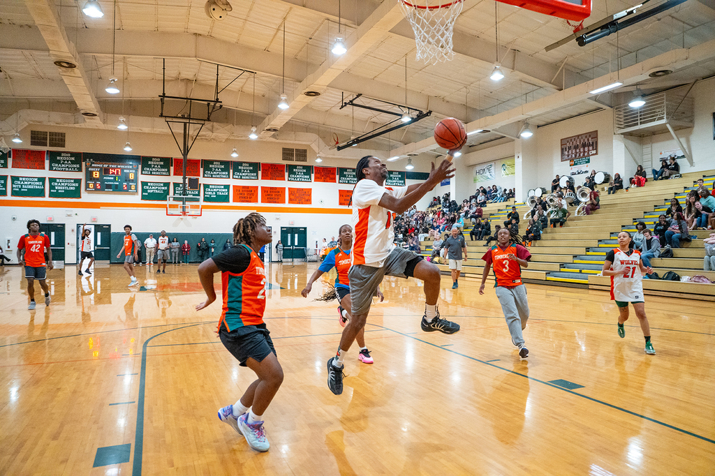staff member going for a basket
