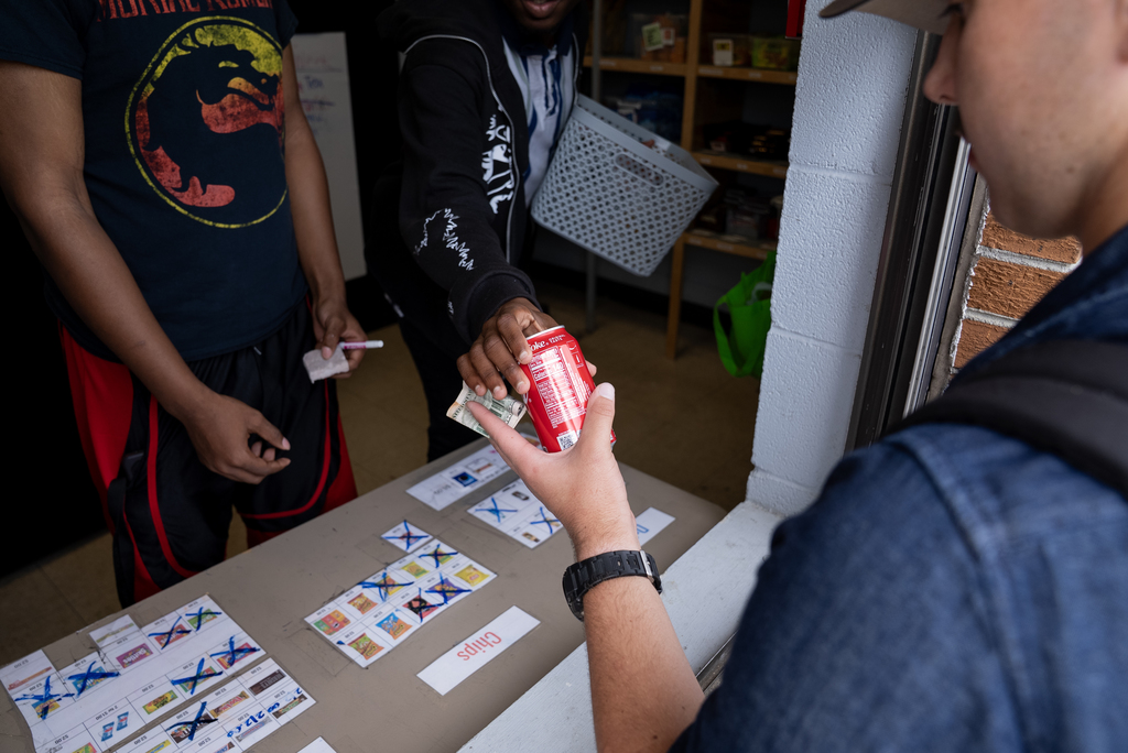 student purchasing a soda