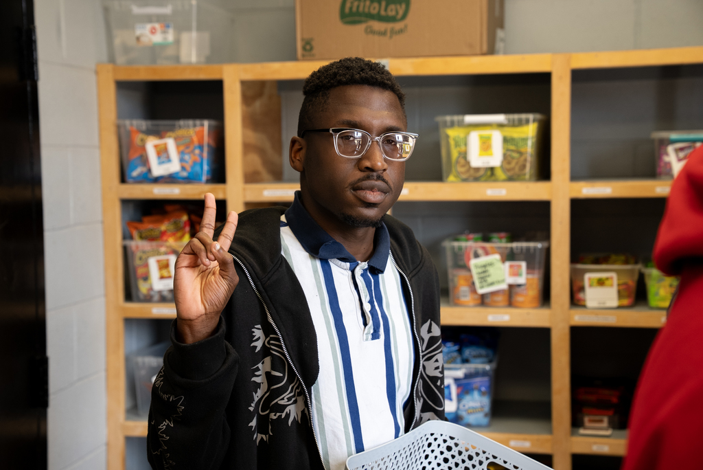Goose Creek High student flashing a peace sign