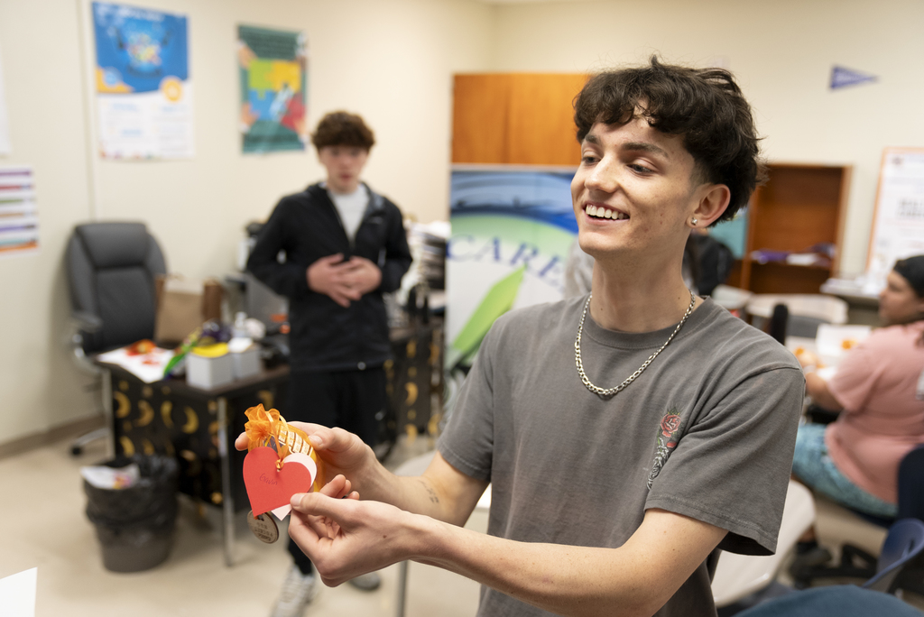 student giving out candygram to other student