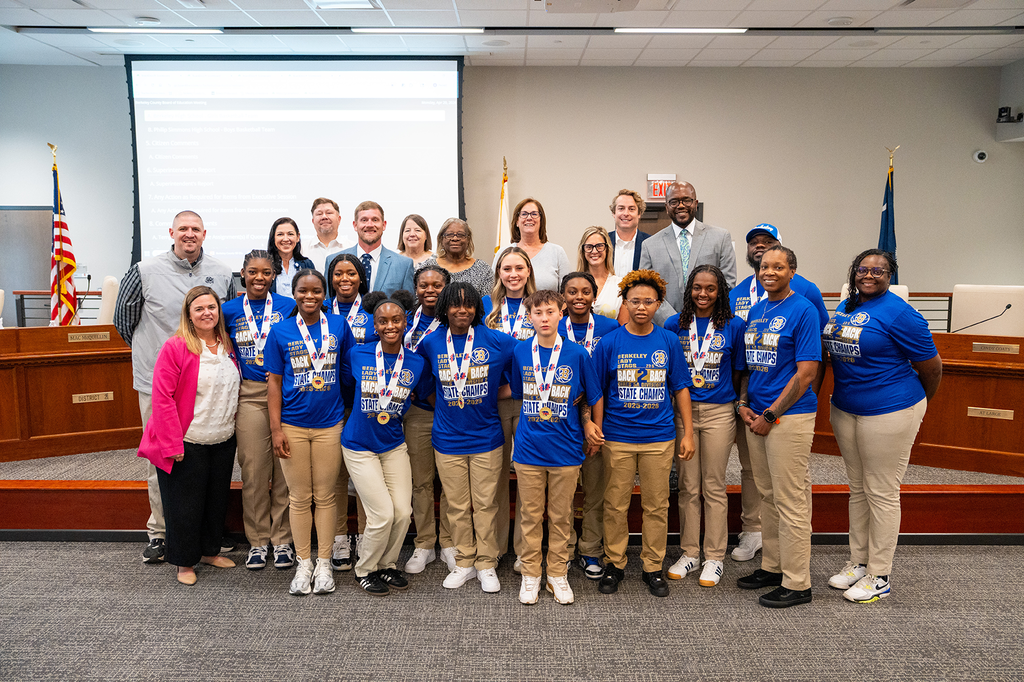 BHS girls basketball team and coaches with school board