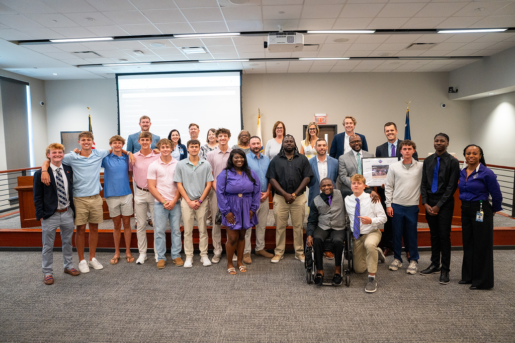 PSH boys basketball team and coaches with board members