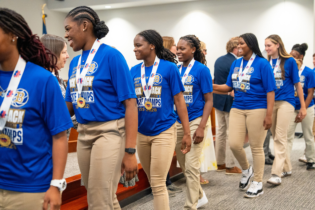 Berkeley High girls basketball team shaking hands with board members
