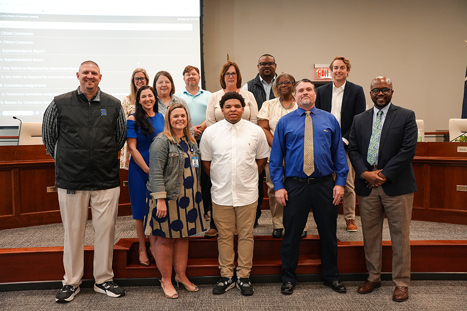Landon Jackson and BHS school administration with board members