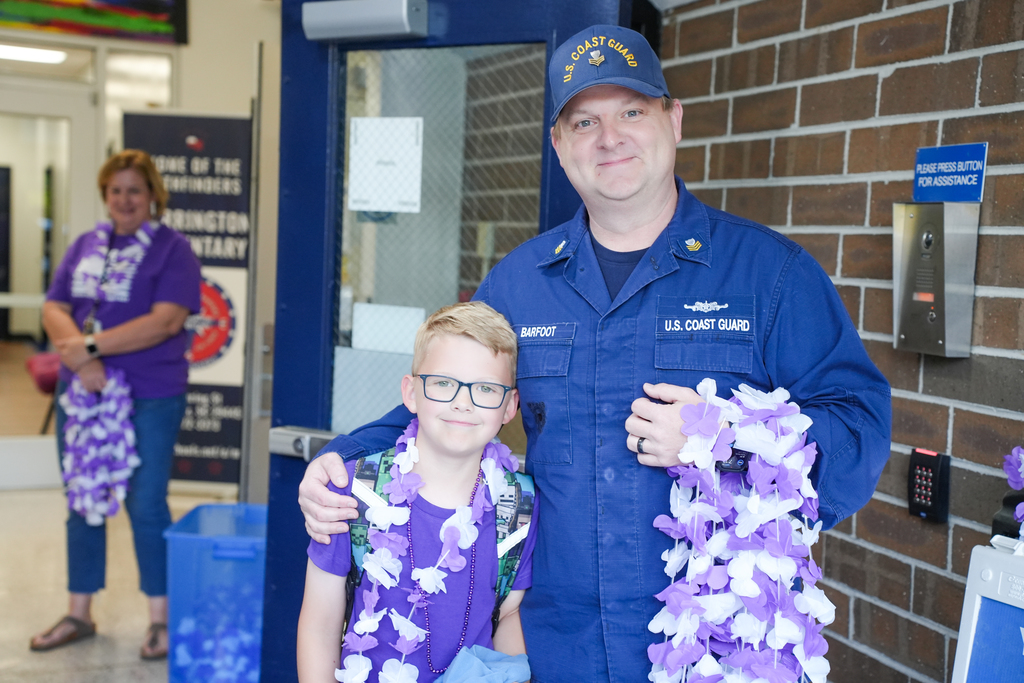 coast guard member smiling with his Marrington Elementary student