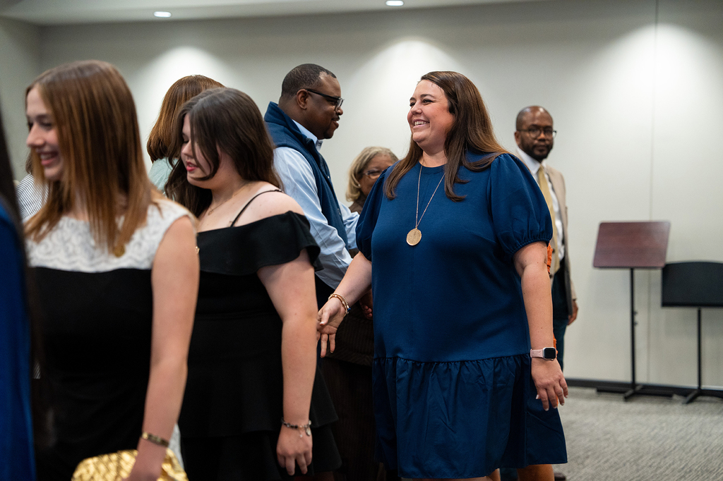 Brittany Colley shaking board members hands