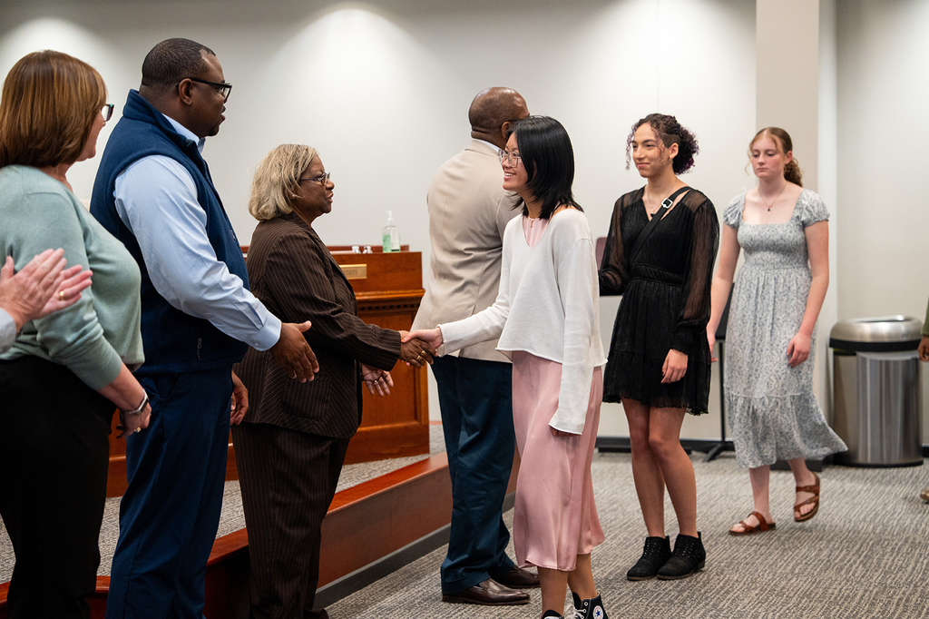 Berkeley High students shaking board members hands