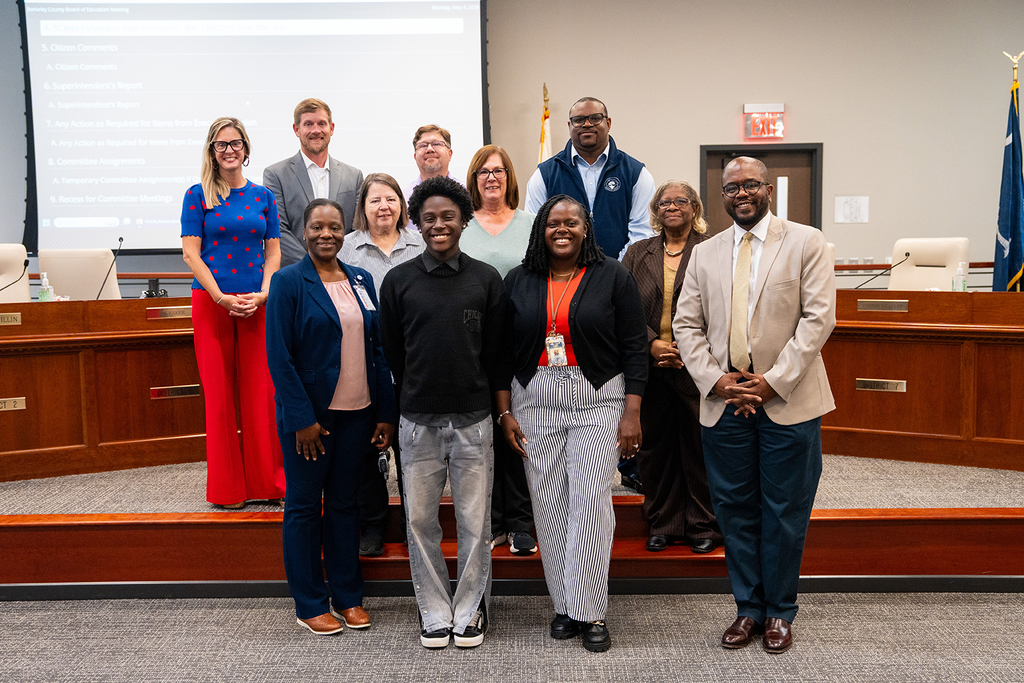 Cross High student with Board of Education