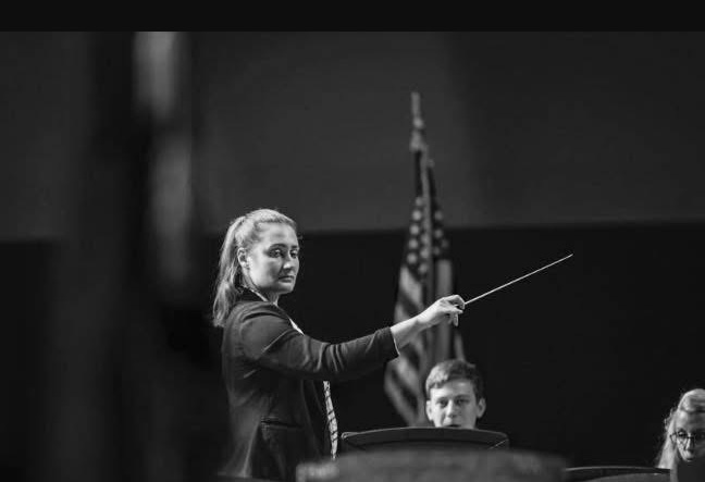 Brittany Delsignore conducting a band