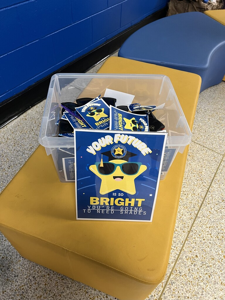 A plastic container with a sign reading "Your Future Bright" sits atop a yellow ottoman. The sign features a cartoon police officer.