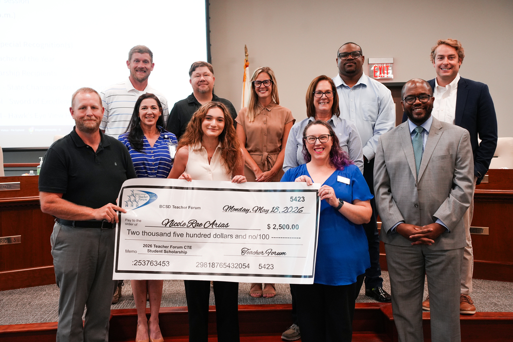 Nicole Arias with teacher forum scholarship check and board members