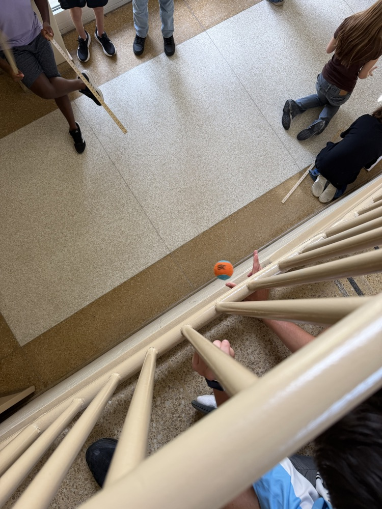 Students in Mrs. Duncan’s AP Physics class measure drop heights and conduct a free-fall experiment.