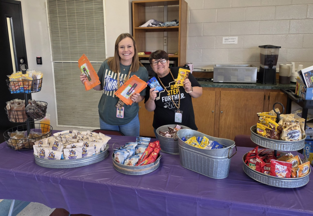 Mrs. Willis & Mrs. Jamie showing snacks up for grabs for Midway Mania
