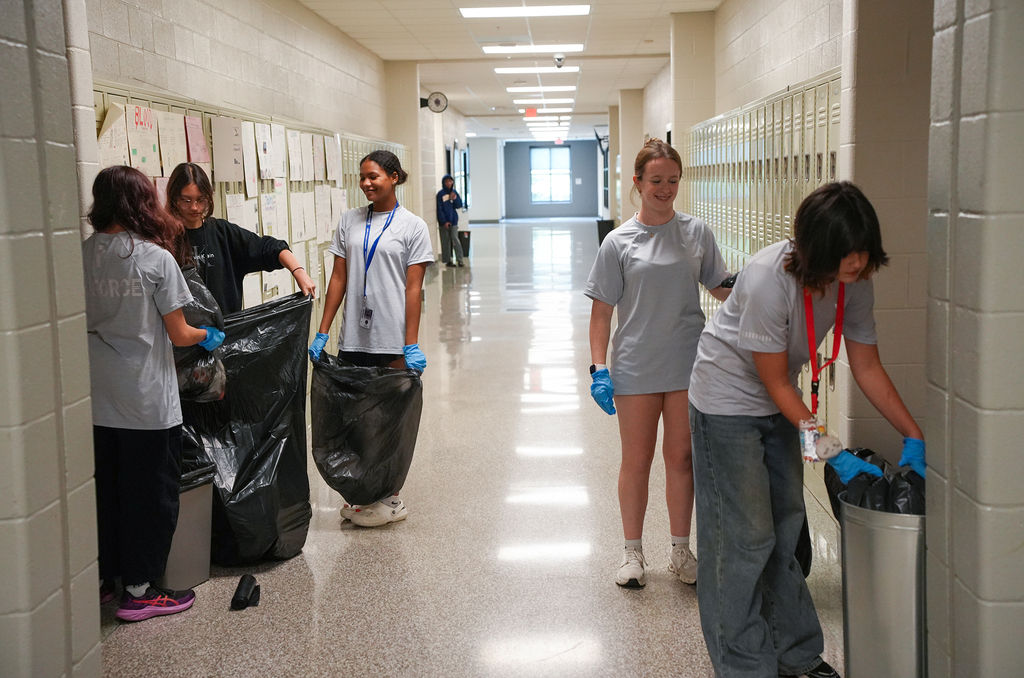 cadets cleaning hallway