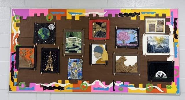 Variety of art work on bulletin board made with cardboard by art students