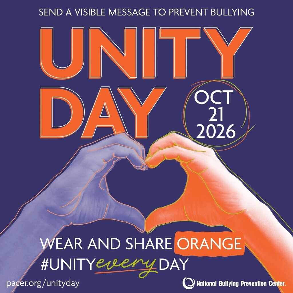 Blue and orange hands forming a heart shape. Text reads "UNITY DAY OCT 21 2026" above hands.