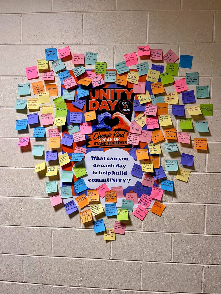Community Building Post-It Notes form the shape of a heart around the words "What can you do every day to help build commUNITY?"