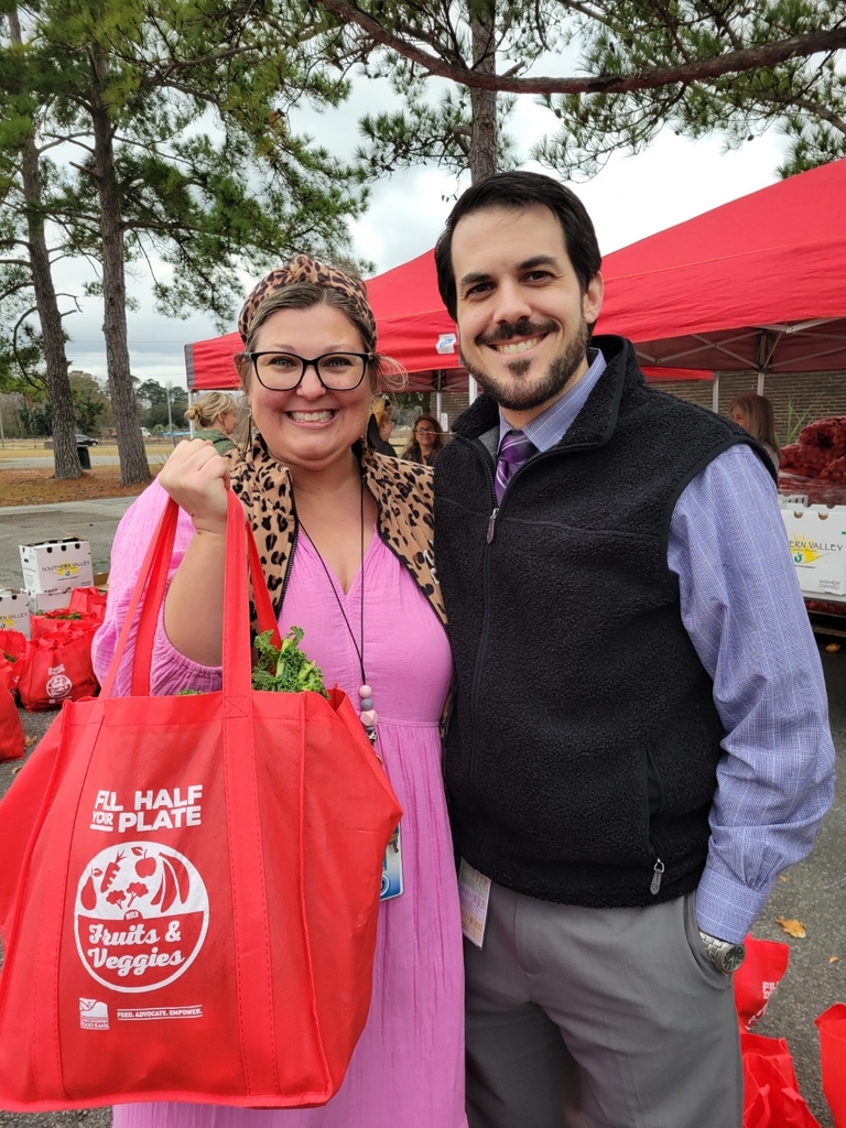 Principal Wyatt and Bradley at the food bank giveaway