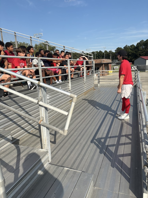 potter with players in stands
